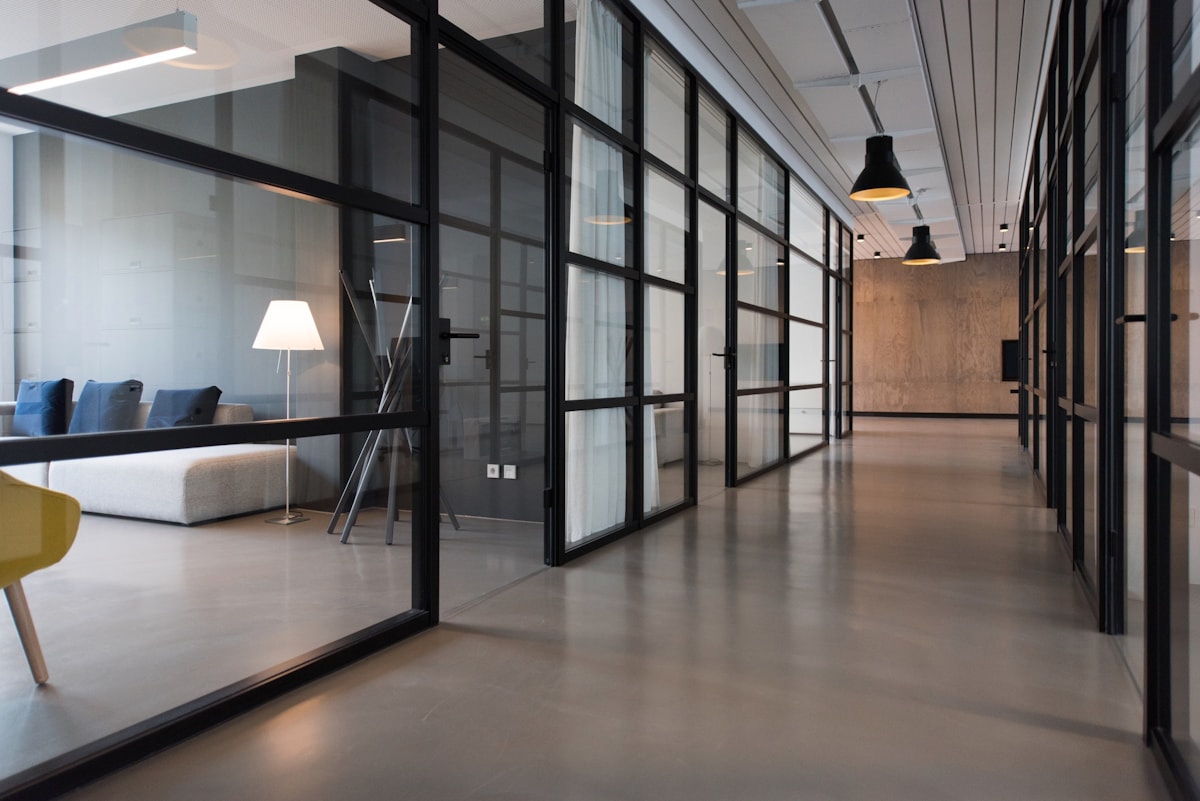 A modern corporate office with glass meeting rooms